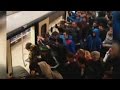 See dozens of passengers push train to rescue woman