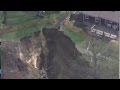 Collapsing hillside forces families to evacuate homes